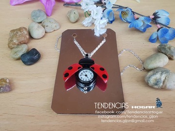 Reloj de colgar mariquita